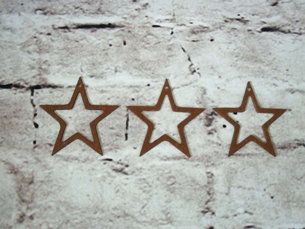 Rustic Steel Star Garden Gift Set - Rusted smaller metal stars garden decorations shown on a light brick patterned surface