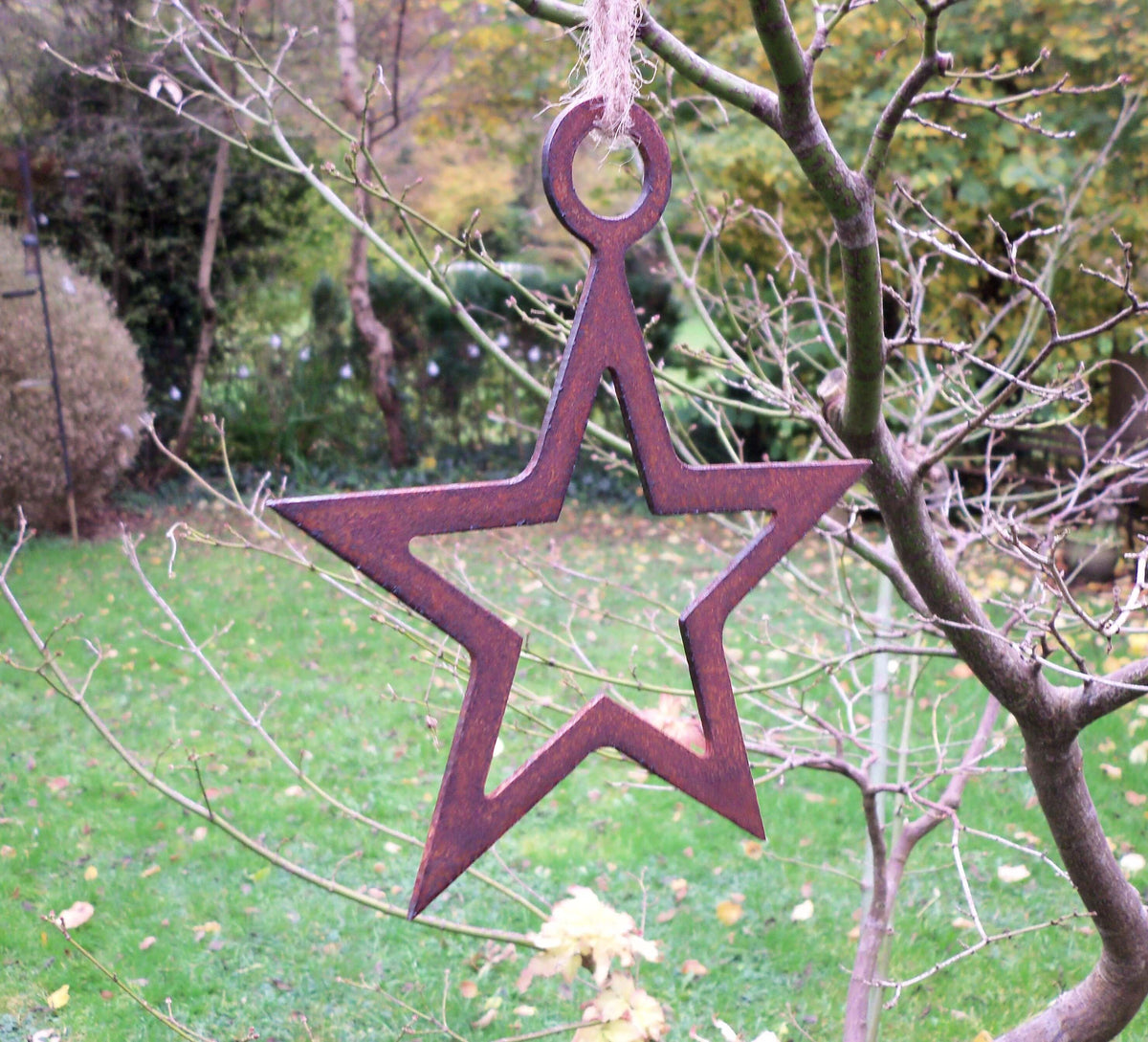 Rustic Steel Star Garden Gift Set - Rusted metal hanging star garden ornament hanging from a twig with string