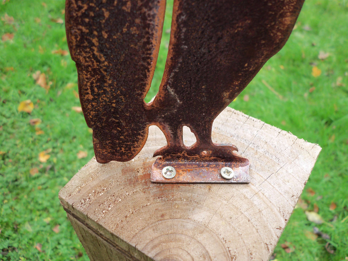 Rusted Steel Owl Garden Ornament resting on wooden post, showcasing unique rusted patina finish and rustic charm.