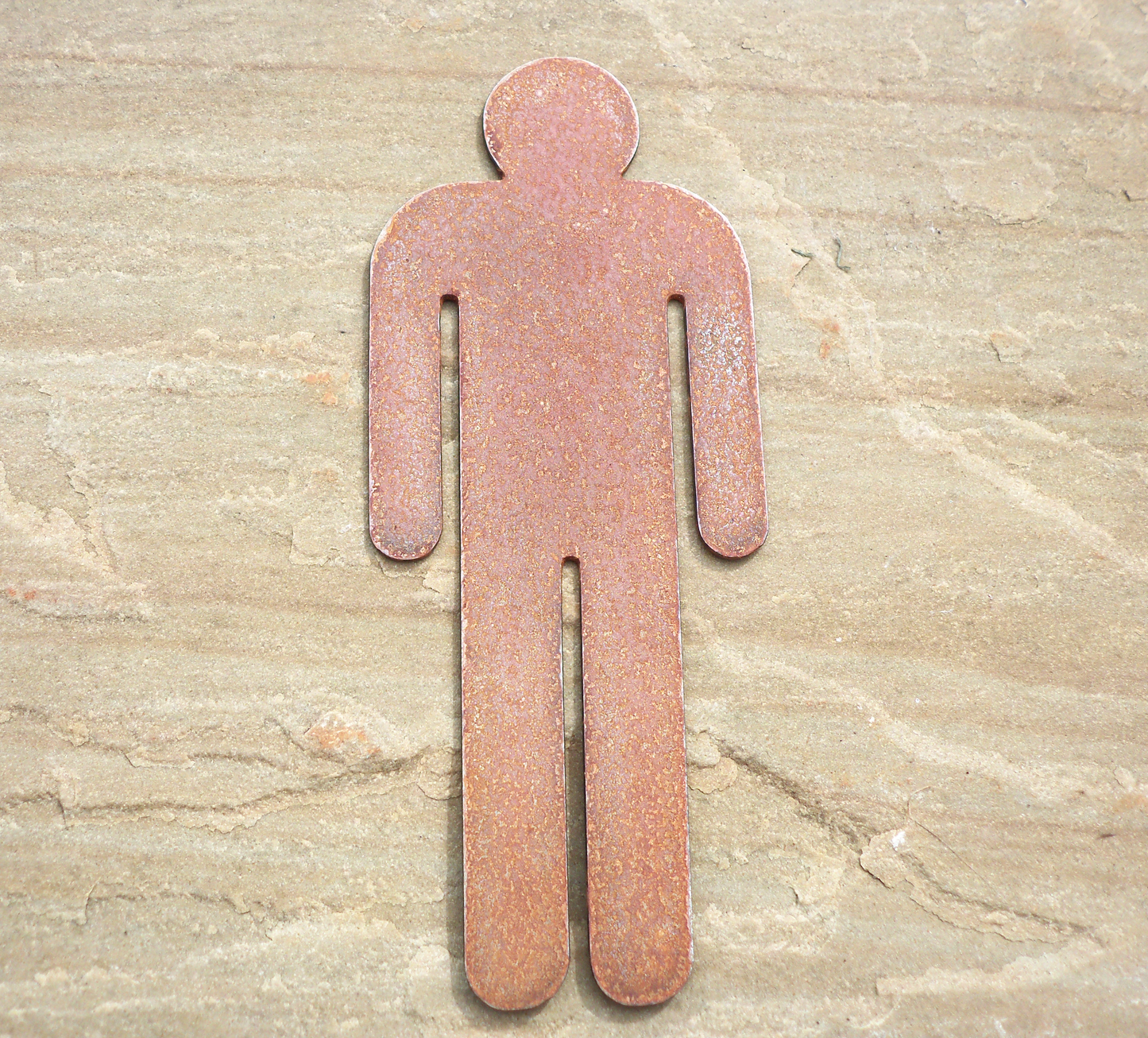 Rustic Metal WC Toilet Door Signs - male symbol on a stone surface