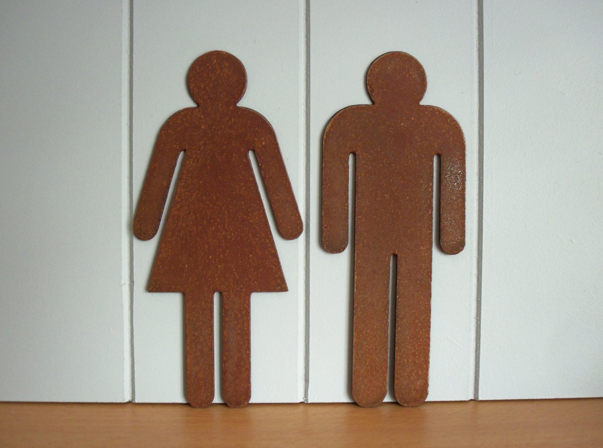 Rustic Metal WC Toilet Door Signs - male and female symbols on a white background