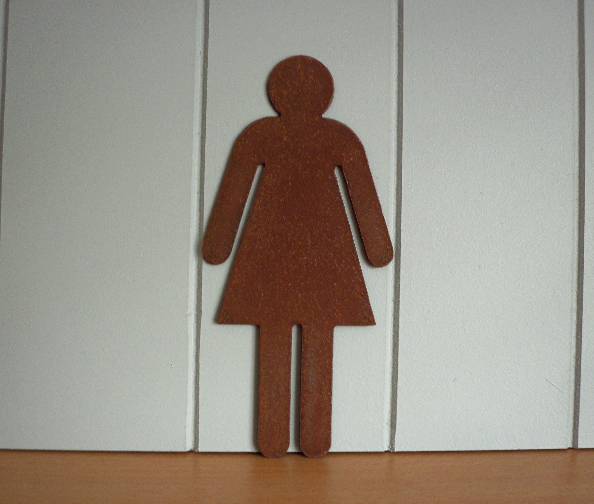 Rustic Metal WC Toilet Door Signs - female symbol on a white wooden panel background