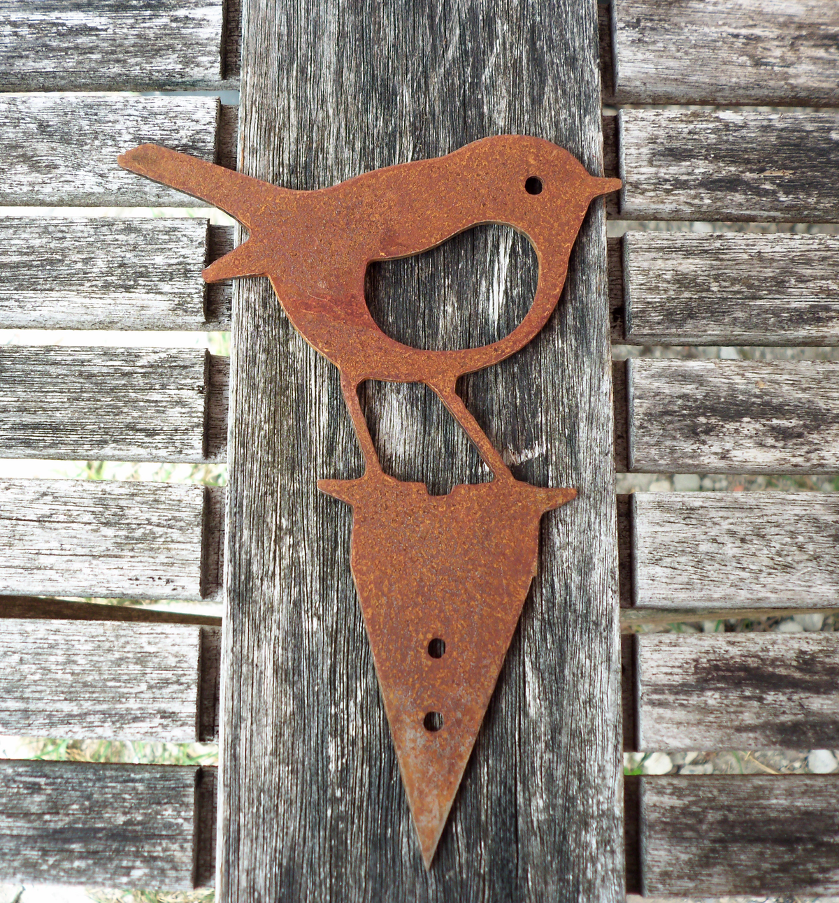 Rusty Steel Robin Garden Ornament displayed on wooden surface, showcasing its rustic charm and handmade design.