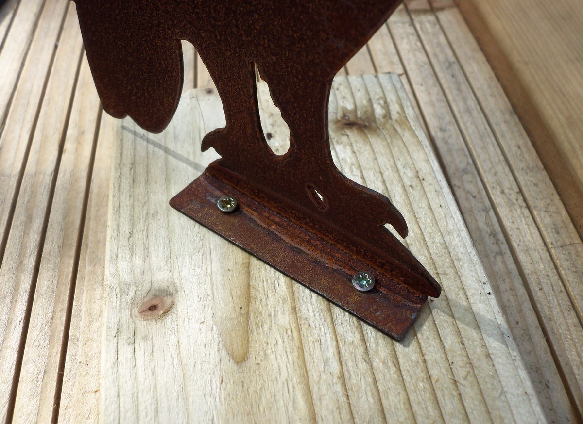 Rustic Steel OWL Garden Ornament base showing intricate design and rustic patina finish on wooden planks.