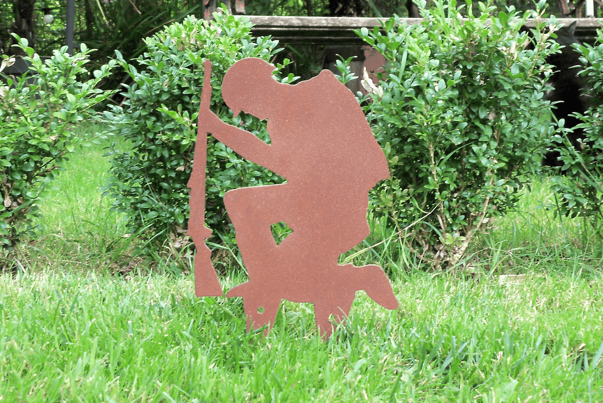 Rustic Steel SOLDIER Garden Ornament - Kneeling metal military art decoration with rustic finish in garden.