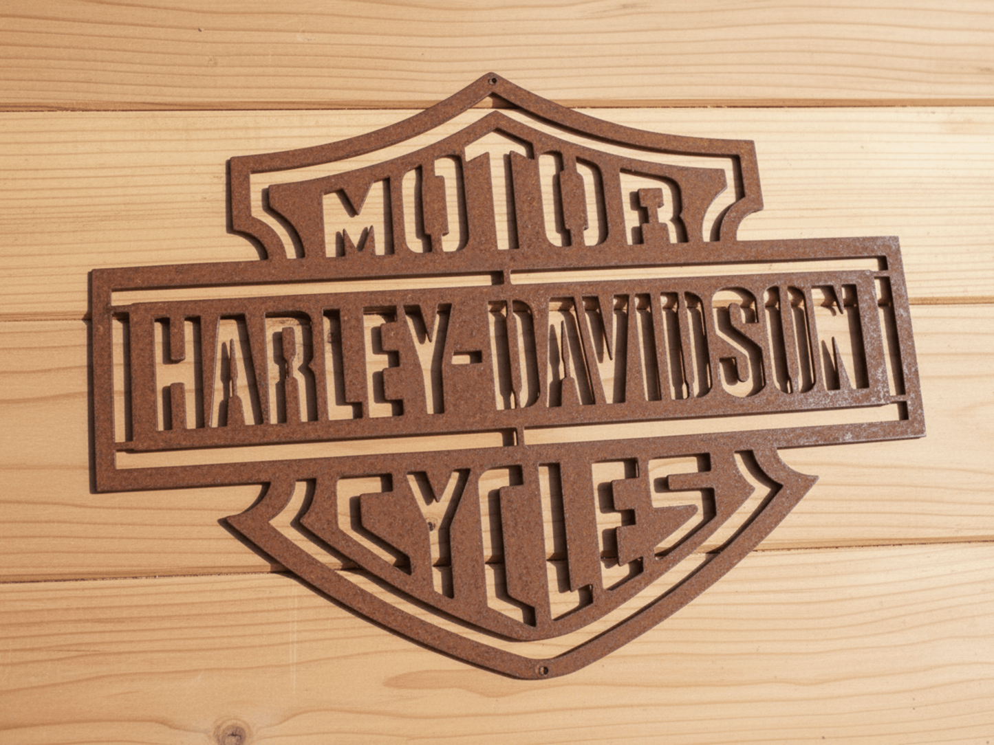 Rustic Metal Harley Davidson Motorcycle Badge Sign on a wooden background