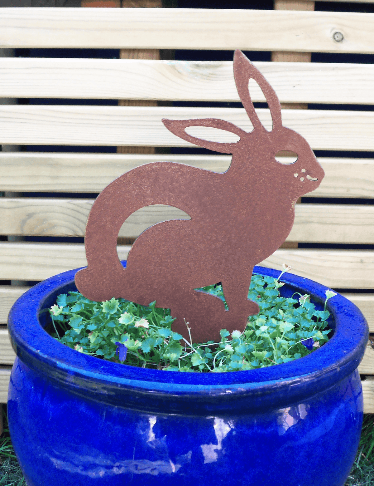 Rusted Steel RABBIT Garden Ornament in blue pot, showcasing unique rusted finish and industrial style