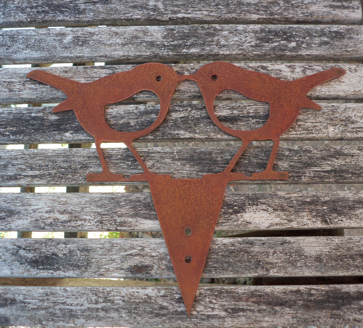 Rusty steel kissing robins garden ornament, rustic metal bird decoration for garden or fence.
