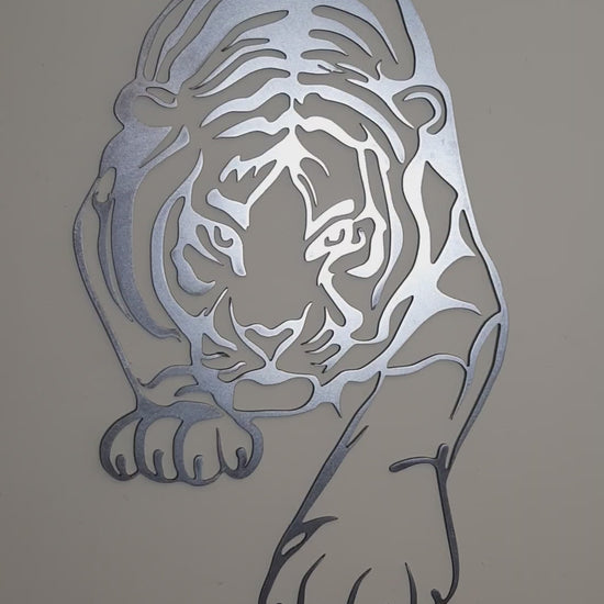 Statement metal tiger wall art decoration on a clean neutral-toned wall